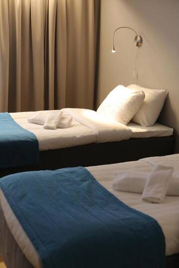Фото номера Двухместный номер бизнес-класса с 2 отдельными кроватями Отель Hotel Nukkumatti г. Коккола 7