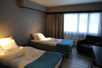 Фото номера Двухместный номер бизнес-класса с 2 отдельными кроватями Отель Hotel Nukkumatti г. Коккола 4